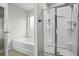 Bright bathroom with a soaking tub, glass enclosed shower, and neutral paint at 3573 Stonebranch Ln, Loganville, GA 30052