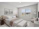 Serene bedroom with a large window and neutral decor at 3573 Stonebranch Ln, Loganville, GA 30052