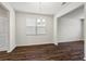 Dining area with hardwood flooring and a modern chandelier illuminates the room at 3573 Stonebranch Ln, Loganville, GA 30052
