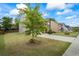 Charming two-story home with manicured lawn, driveway, and welcoming curb appeal on a sunny day at 3573 Stonebranch Ln, Loganville, GA 30052
