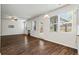 Bright living room features a ceiling fan and large windows at 3573 Stonebranch Ln, Loganville, GA 30052
