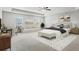 Spacious main bedroom with desk, sitting area, a ceiling fan, and multiple windows at 3573 Stonebranch Ln, Loganville, GA 30052