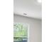 A window with blinds lets natural light into the room, providing a view to the outside at 3573 Stonebranch Ln, Loganville, GA 30052