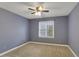 Cozy carpeted bedroom with a window and neutral walls, creating a serene space at 4535 Clipper Bay Rd, Duluth, GA 30096
