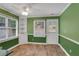 Bright dining area with green walls, a ceiling fan, and a view of the backyard at 4535 Clipper Bay Rd, Duluth, GA 30096