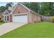 One-story home featuring a well-maintained lawn and an attached two-car garage at 4535 Clipper Bay Rd, Duluth, GA 30096