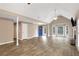 Spacious living room featuring hardwood floors, vaulted ceiling, and a fireplace at 4535 Clipper Bay Rd, Duluth, GA 30096