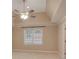 Bright carpeted main bedroom featuring a ceiling fan and a window with neutral paint at 4535 Clipper Bay Rd, Duluth, GA 30096