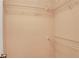 Uncluttered walk-in closet featuring wire shelving and neutral paint at 4535 Clipper Bay Rd, Duluth, GA 30096