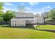 Spacious backyard with patio, well-maintained lawn, and mature trees at 660 Cranberry Ct, Roswell, GA 30076