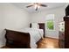 Clean and well-lit bedroom featuring hardwood floors and a comfortable bed at 660 Cranberry Ct, Roswell, GA 30076