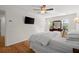 Spacious bedroom with hardwood floors, natural light, and modern furnishings at 660 Cranberry Ct, Roswell, GA 30076