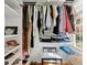 Organized walk-in closet with custom shelving, hanging racks, and natural light at 660 Cranberry Ct, Roswell, GA 30076