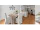 Bright dining and kitchen area with hardwood floors and modern appliances at 660 Cranberry Ct, Roswell, GA 30076