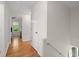 Hallway with hardwood floors leading to bedroom at 660 Cranberry Ct, Roswell, GA 30076