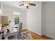 Cozy home office featuring hardwood floors, zebra rug, and natural light at 660 Cranberry Ct, Roswell, GA 30076