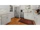 Updated kitchen features stainless steel appliances, ample storage, and hardwood floors at 660 Cranberry Ct, Roswell, GA 30076