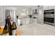 Updated kitchen with granite countertops, stainless appliances, and ample cabinet space at 660 Cranberry Ct, Roswell, GA 30076