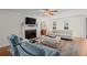 Cozy living room with fireplace, neutral tones, plush seating, and natural light, creating a warm ambiance at 660 Cranberry Ct, Roswell, GA 30076