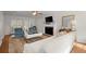 Bright living room featuring a fireplace, ceiling fan, and comfortable seating, perfect for relaxation at 660 Cranberry Ct, Roswell, GA 30076