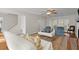 Bright living room with neutral decor, ceiling fan, fireplace, and access to the backyard at 660 Cranberry Ct, Roswell, GA 30076