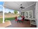 Covered patio with table and chairs overlooks the backyard at 660 Cranberry Ct, Roswell, GA 30076