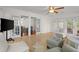 Bright sunroom with tile floors, many windows and glass doors to covered patio at 660 Cranberry Ct, Roswell, GA 30076