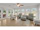Bright sunroom with tile flooring, ample natural light, and comfortable seating, ideal for relaxation at 660 Cranberry Ct, Roswell, GA 30076