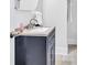 Bathroom sink with black vanity and white countertop at 11 Poplar St, Porterdale, GA 30014