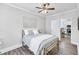 Cozy bedroom with light wood floors and access to the kitchen at 11 Poplar St, Porterdale, GA 30014