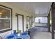 Inviting porch with table and chairs, enhancing outdoor enjoyment and relaxation at 11 Poplar St, Porterdale, GA 30014