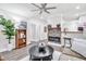 Comfortable living room with hardwood floors and a fireplace, creating a cozy and inviting atmosphere at 11 Poplar St, Porterdale, GA 30014