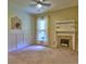 Neutral bedroom features a decorative fireplace and wall paneling, creating a cozy atmosphere at 111 Churchcliff Dr, Woodstock, GA 30188
