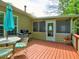 Outdoor deck with a grill is accessible to the home, offering a perfect spot for summer BBQs at 111 Churchcliff Dr, Woodstock, GA 30188