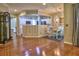 Open-concept dining area with hardwood floors and adjacent kitchen at 111 Churchcliff Dr, Woodstock, GA 30188