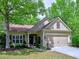 Charming one-story home with well-maintained lawn, inviting curb appeal and attached two-car garage at 111 Churchcliff Dr, Woodstock, GA 30188
