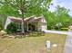 Charming one story home with an attached garage, well manicured landscaping and mature trees at 111 Churchcliff Dr, Woodstock, GA 30188
