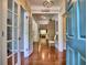 Elegant foyer featuring hardwood floors, open layout, and access to multiple rooms at 111 Churchcliff Dr, Woodstock, GA 30188