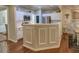 Kitchen with stainless steel appliances and white cabinets, open to dining area at 111 Churchcliff Dr, Woodstock, GA 30188