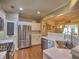 Bright, open kitchen featuring stainless steel appliances and an eat-in area at 111 Churchcliff Dr, Woodstock, GA 30188