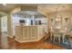 Kitchen and dining room area, featuring stainless steel appliances and white cabinetry at 111 Churchcliff Dr, Woodstock, GA 30188