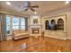 Spacious living room with fireplace, built-in shelving, and hardwood floors at 111 Churchcliff Dr, Woodstock, GA 30188