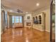 Bright living room featuring hardwood floors, fireplace, built-ins, and plenty of natural light at 111 Churchcliff Dr, Woodstock, GA 30188
