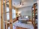 Cozy living room featuring hardwood floors, area rug, natural light and ceiling fan at 111 Churchcliff Dr, Woodstock, GA 30188