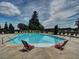Large community pool surrounded by lounge chairs, perfect for relaxing and enjoying sunny days at 111 Churchcliff Dr, Woodstock, GA 30188