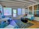 Relaxing sunroom features a comfortable seating area and abundant natural light from many windows at 111 Churchcliff Dr, Woodstock, GA 30188