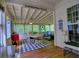 Spacious sunroom has plenty of seating, natural light and a dining area, perfect for entertaining at 111 Churchcliff Dr, Woodstock, GA 30188