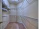 Spacious walk-in closet with extensive shelving for maximum storage and organization at 111 Churchcliff Dr, Woodstock, GA 30188