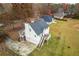 An elevated shot shows the home, large back yard, and surrounding neighborhood at 115 N Loblolly Xing, Temple, GA 30179