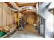 Unfinished basement with exposed beams, shelving, and utilities at 115 N Loblolly Xing, Temple, GA 30179